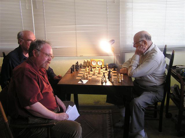 Above Right: GM Arnold Denker's last chess game. Tim Redman and Don Schultz lost a consultation match withArnold on Dec. 13, 2004. One month short of his ninety-first birthday, Arnold passed away Jan. 2, 2005.